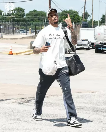 Gallery Dept. Black Paint Splatter Flared Sweatpants worn by Paul Jamaine Washington Jr. on the Instagram account @dallasmavs