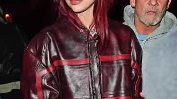 BRIT Awards 2024 Dua Lipa Maroon Leather Jacket worn by Dua Lipa on the Instagram account @justjared