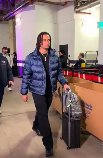 Louis Vuitton Black Monogram Horizon 55 Suitcase worn by CJ Stroud on the Instagram account @houstontexans