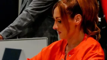 Becky Lynch Orange Cropped Bomber Jacket worn by Becky Lynch on the Instagram account @beckylynch__thegoat