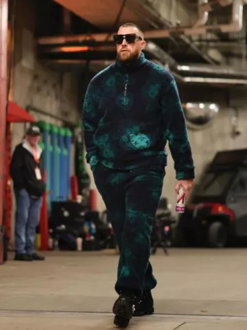 Louis Vuitton Navy & Green Elevation Camo Fleece Jacket worn by Travis Kelce on the Instagram account @killatrav