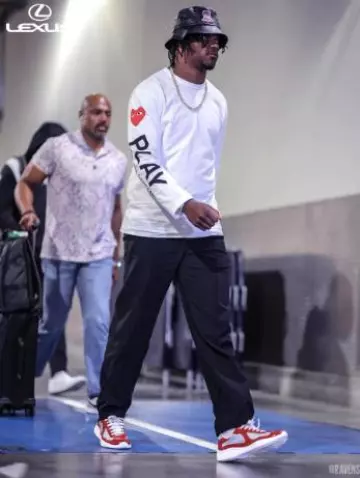 Comme des Garcons White Sleeve Logos Long Sleeve T Shirt worn by Lamar Jackson on the Instagram account @ravens