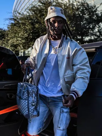 Amiri Stone Indigo M65 Cargo Jeans worn by CeeDee Lamb on the Instagram account @dallascowboys