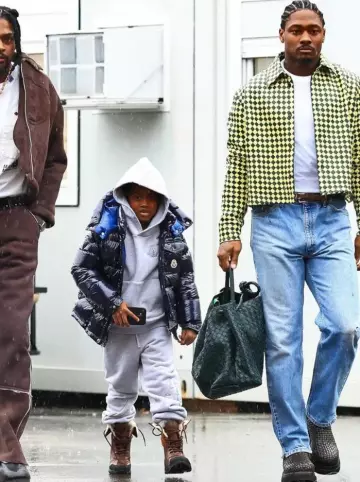 Bottega Veneta Brown Intrecciato Leather Lug Boots worn by Stefon Diggs on the Instagram account @buffalobills