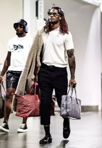 Prada Cream Open Crochet Knit Polo worn by CeeDee Lamb on the Instagram account @dallascowboys