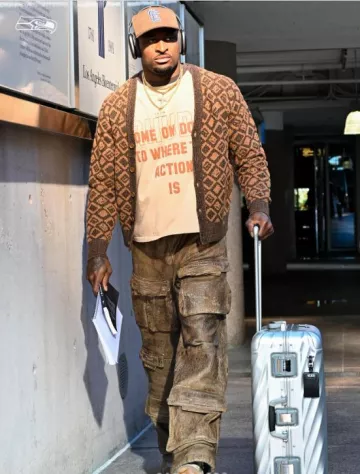 Acne Studios Brown Diamond Faces Cardigan worn by DK Metcalf on the Instagram account @seahawks