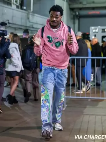 Who Decides War Blue & Large Green Stained Glass Cowboy Jeans worn by Derwin James Jr. on the Instagram account @nfl