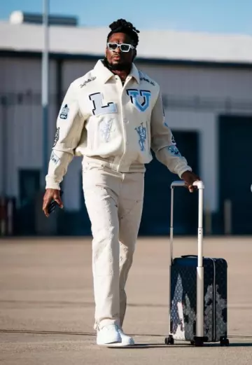 Louis Vuitton Cream Monogram Workwear Jeans worn by Derrick Henry on the Instagram account @titans
