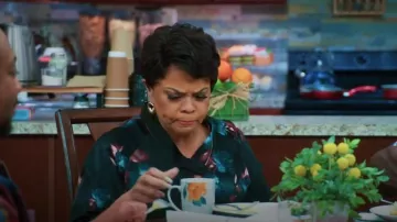 Alfani Plus Tie Neck Blouse Top Black Bold Bouquet worn by Cora (Tamela Mann) as seen in Tyler Perry's Assisted Living (S06E06)