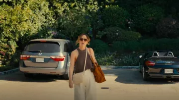 Clare V. Midi Sac Woven Leather Crossbody Bag worn by Sylvia (Rose Byrne) as seen in Platonic (S02E01)
