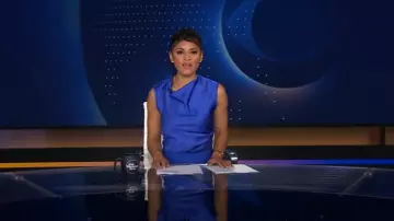 Herve Leger Audrey Satin Cowl Top worn by Jericka Duncan as seen in CBS Evening News on August 4, 2025