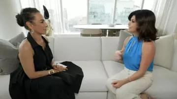 Elie Tahari Pleated Fit & Flare Belted Halter Midi-Dress worn by Michelle Miller as seen in CBS Mornings on August 3, 2025