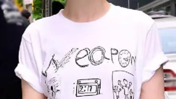 NYC White Graphic Tee worn by Julia Garner in Julia Garner Loves The Heralding Galactus Trend !