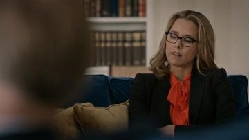 The blouse is orange silk Givenchy worn by Elizabeth McCord (Téa Leoni) in Madam Secretary S03E15