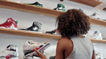 The pair of Nike Air Jordan 1 grey / gray in Kicks