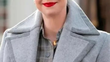 Wednesday S01 Gwendoline Christie Grey Trench Coat worn by Principal Larissa Weems (Gwendoline Christie) in Wednesday (S01)