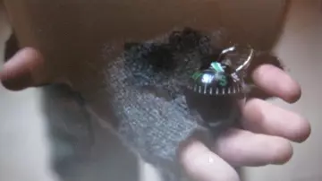 Billy Batson's (Asher Angel) compass keychain in Shazam!