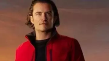 Gran Turismo Danny Moore Red Puffer Jacket worn by Danny Moore (Orlando Bloom) as seen in Gran Turismo