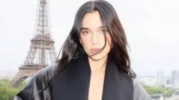 Harper’s Bazaar US Black Leather Jacket worn by Dua Lipa in Dua Lipa's GRAMMYs Dress Honored Gianni Versace | Fashion Flashback | Harper's BAZAAR