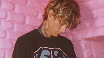 MGK X Cleveland Browns Long Sleeve T-Shirt worn by Self (Machine Gun Kelly) as seen in Machine Gun Kelly's Life In Pink