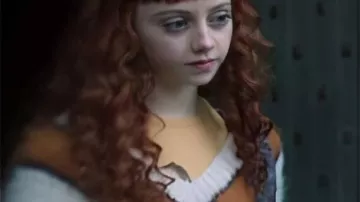 Wednesday White & Mustard V Neck Sweater worn by (Evie Templeton) as seen in Wednesday (S02E08)