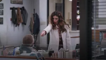 Stella McCartney Lips Print Tie Neck Blouse worn by Esmeralda Grand (Sabrina Impacciatore) as seen in The Paper (S01E09)