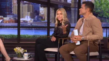 Saint Laurent Tie Neck Polka Dot Silk Blouse worn by Kelly Ripa as seen in LIVE with Kelly and Mark on September 11, 2025