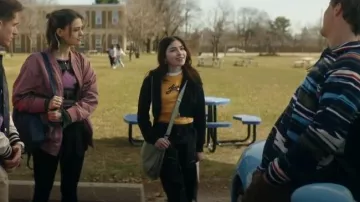Levi’s Yellow Logo Cropped Ringer Tee worn by Caitlyn Torres (Melissa Collazo) as seen in Motorheads (S01E01)