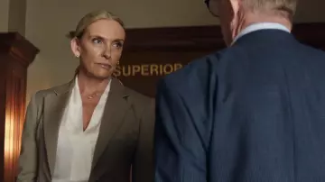 Juror #2 Movie Wardrobe: Toni Collette wears a beautiful Gold Necklace to play The Prosecutor
