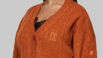 The Life Of A Showgirl Cardigan worn by Taylor Swift in Taylor Swift’s Life of a Showgirl Coming to Theaters for Release Party | E! News