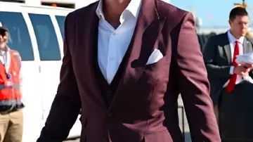 New Jersey Burgundy Suit worn by Travis Kelce in Travis Kelce Tries Carrying Jason’s Baby Girl For The First Time | Kelce Documentary