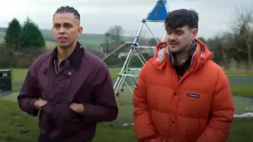 Berghaus Lumley Insulated Down Jacket Flame Red worn by Leslie "Cardi" Titt (Tom Hanson) as seen in Brassic (S07E01)