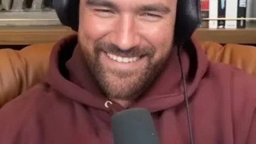 New Heights Maroon Graphic Hoodie worn by Travis Kelce in Travis is Feeling 2-2, Eagles 4-0 Frustrations, Coach Fights and Jason's Ireland Adventure | Ep 157