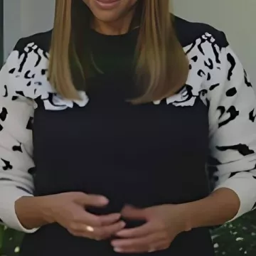 Leopard Sleeve Sweater worn by Tyra Banks in Celebrity IOU 2025 HGTV