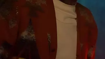 Cárdigan naranja de Vincent "Vinnie" O'Neill (Joe Gilgun) en latón