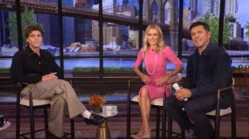 Amiri Leather Patch MA Cardigan worn by Lukas Gage as seen in LIVE with Kelly and Mark on October 10, 2025