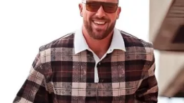 Monogram Flannel Plaid Polo Shirt worn by Travis Kelce in Travis Kelce Gets Decked in Velvet for the Chiefs' Game Against the Raiders: See His Festive Fit