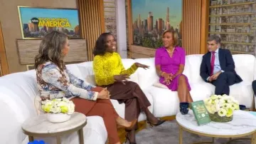 JW Anderson Pleated Satin D-Ring Wide-Leg Tousers worn by Deborah Roberts as seen in Good Morning America on  October 21, 2025