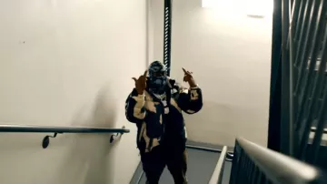 Supreme x The North Face Black Bleached Nuptse Jacket worn by Blac Youngsta in Blac Youngsta - Background (Official Video)