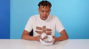 Beats by Dre White & Gold Beats Studio3 Headphones worn by YBN Cordae in 10 Things YBN Cordae Can't Live Without | GQ