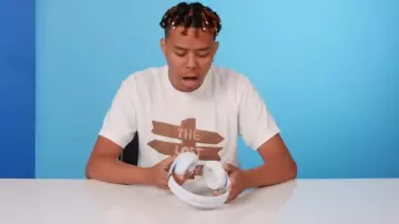 Merch White The Lost Boy Direction Sign Merch T Shirt worn by YBN Cordae in 10 Things YBN Cordae Can't Live Without | GQ