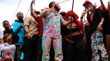 Givenchy x BSTROY Multicolor Stamp Print Jeans worn by El Alfa in EL ALFA EL JEFE X ROCHY RD - LOS POBRES Y LOS RICOS