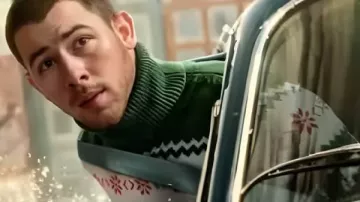 A Very Jonas Christmas Movie 2025 Nick Jonas Green Sweater