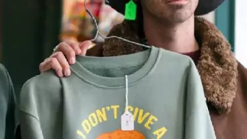 Joe Jonas “I Don’t Give A Schnitzel” Grey Shirt worn by Joe Jonas (Joe Jonas) as seen in A Very Jonas Christmas Movie