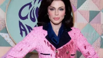 Julia Fox The Cursed Amulet Party Pink Blazer in the music video Julia Fox Sparks Controversy with Disturbing Jackie Kennedy Halloween Costume