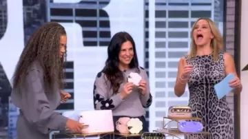 Aqua Cashmere Floral Sleeve Sweater worn by Honor Elliott as seen in The View on November 5, 2025