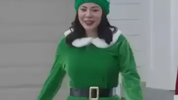 Christmas On Duty 2025 Janel Parrish Green Elf Costume worn by Blair Birch (Janel Parrish) in Christmas on Duty