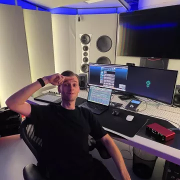 Whoop MG worn by Neal Huybens (Judge Neal) when teasing new music in the studio