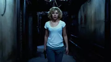 The worn-out boyfriend jeans worn by Lucy (Scarlett Johansson) in the movie Lucy