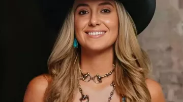 Lainey Wilson CMA Fest Cowboy Leather Vest in the music video Brooks & Dunn and Lainey Wilson – “Play Something Country” | CMA Fest 2025